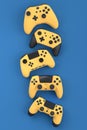 Set of flying gamer joysticks or gamepads on blue background