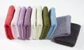 Set of folded colorful towels, isolated on white background Royalty Free Stock Photo