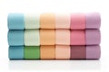 Set of folded and rolled colorful towels on white Royalty Free Stock Photo