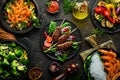 Set of food and dishes of vegetables, meat and fish on wooden background. Top view. Royalty Free Stock Photo