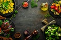 Set of food and dishes of vegetables, meat and fish on wooden background. Top view. Royalty Free Stock Photo