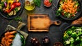 Set of food and dishes of vegetables, meat and fish on wooden background. Top view. Royalty Free Stock Photo