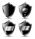 Set of four black steel shields