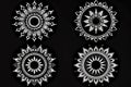 A set of four black and white circular designs. Suitable for various graphic design projects Royalty Free Stock Photo