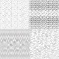 Set of four black and white seamless hand drawn texture designs for backgrounds. Royalty Free Stock Photo