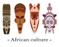 Set of four color traditional African masks on a white background.