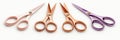 Set of four colorful metal scissors arranged in a row on white background Royalty Free Stock Photo