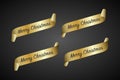 Set of four gold curled paper ribbon and Merry Christmas inscription on a black background