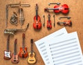 Set of four guitars, five golden brass wind and four string musical orchestra instruments. Royalty Free Stock Photo