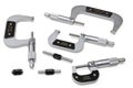 Set of four micrometers and calibration tools on white background Royalty Free Stock Photo