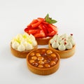 Set of four mini tart with raspberry berries, cream and hazelnut Royalty Free Stock Photo