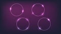 Set of four neon circle frames with shining effects