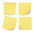 Set of four realistic blank yellow post it notes isolated