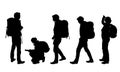 Set of four realistic silhouettes of male and female tourists with map and backpack, vector Royalty Free Stock Photo