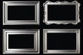 Set of four silver picture frames on a black background. Ideal for showcasing photos or artwork Royalty Free Stock Photo