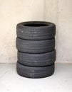 Set of four stacked used car tires