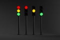 set of four traffic lights with signals of different colors isolated on a dark background Royalty Free Stock Photo