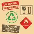 Set of fragile sticker and case icon packaging symbols sign,  do not crush,  flammable, high voltage on rubber stamp on cardboard Royalty Free Stock Photo