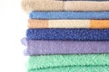 Set of fresh bath towels in bright colors. Soft towels for kitchen and bathroom with text space Royalty Free Stock Photo