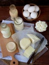 Set of fresh dairy products on wooden background: milk cheese cottage yogurt egg mozzarella ryazhenka feta. Royalty Free Stock Photo