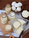 Set of fresh dairy products on wooden background: milk cheese, cottage, yogurt egg mozzarella ryazhenka feta. Royalty Free Stock Photo