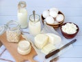 Set of fresh dairy products on wooden background: milk, cheese cottage yogurt egg mozzarella, ryazhenka feta. Royalty Free Stock Photo