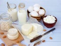 Set of fresh dairy products on wooden background: milk, cheese cottage, yogurt egg, mozzarella ryazhenka, feta. Royalty Free Stock Photo