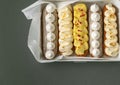 Set of fresh eclairs with original butter cream and meringue cookies decoration