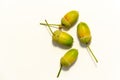 Set of fresh green acorn on white background. Top view of four acorn fruits. Copy space