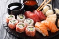 Set of fresh maki, uramaki and nigiri sushi, served on black plate. Horizontal Royalty Free Stock Photo