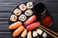 Set of fresh maki, uramaki and nigiri sushi, served on black plate. horizontal top view Royalty Free Stock Photo