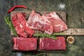 Set of fresh raw alternative beef steaks on a wooden Board Royalty Free Stock Photo