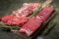 Set of fresh raw alternative beef steaks on a wooden Board: Denver, Skirt, Flank, Machete Royalty Free Stock Photo