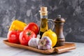 Set of fresh raw vegetables. Tomato, bell pepper, garlic and lemon on a wooden tray. Healthy eating. Organic food Royalty Free Stock Photo