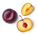 Set of fresh ripe whole, half and sliced plum