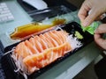 Set of Fresh Salmon Sashimi with Wasabi at the Office Royalty Free Stock Photo