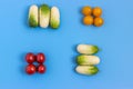 Set fresh vegetables, cucumber, tomatoes on a blue background.  Healthy food concept. Flat lay, top view Royalty Free Stock Photo
