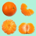 Set of fresh whole and cut mandarin, tangerine and slices isolated on green background. From top view Royalty Free Stock Photo