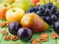 Set of fruits on a green wooden table Royalty Free Stock Photo