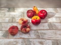 A set of fruits, nectarines, pears, apples lie on a light wooden table. Royalty Free Stock Photo