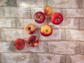 A set of fruits, nectarines, pears, apples lie on a light wooden table. Royalty Free Stock Photo