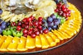 A set of fruits with oranges, kiwi, grapes, cherries and pineapples. The concept of healthy food and vegetarian. Royalty Free Stock Photo