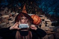 Set of funny Halloween elements. Scary bloody girl in wizard orange hat with pumpkin. Woman with red blood and with