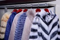 Set of fur coats on metal rack Royalty Free Stock Photo