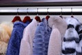 Set of fur coats on metal rack Royalty Free Stock Photo