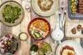 Set of fusion food dishes with a chicken yellow curry with rice and vegetables, a salmon poke bowl, salad, a risotto with cheese, Royalty Free Stock Photo