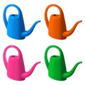 Set of garden plastic watering cans of different colors Royalty Free Stock Photo