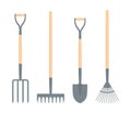 A set of garden tools. Digging spade, digging fork, leaf rake and soil rake isolated on a white background Royalty Free Stock Photo