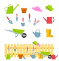 Set of gardening tools on white and composition with a fence Royalty Free Stock Photo