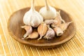 Set garlic big head and clove on a wooden plate fresh harvest Royalty Free Stock Photo